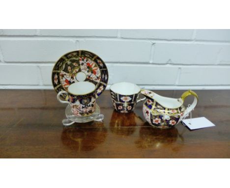 A collection of Royal Crown Derby Imari pattern number 2451 porcelains to include four cups and saucers and a milk jug, (9) 