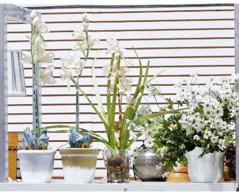 A quantity&nbsp;of potted faux plants and flowers. In varied pots and vases to include an oval planter with moulded leaf deco