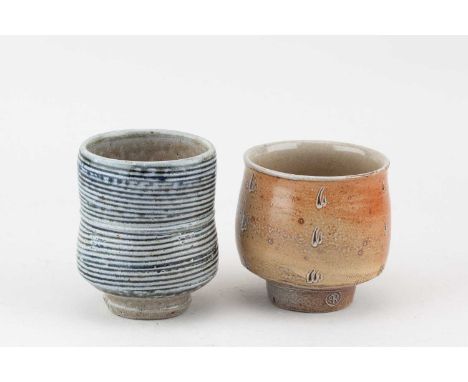 † PHIL ROGERS (1951-2020); a salt glazed yunomi with combed decoration, impressed PR mark, height 10cm, and a slightly smalle