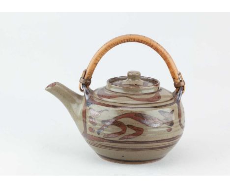 † HARRY DAVIS (1910-1986) & MAY DAVIS (1914-1998) for Crowan Pottery; a large stoneware teapot with cane handle covered in gr