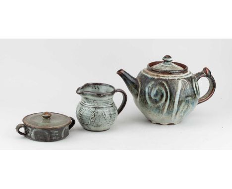 Abuja Pottery; a stoneware teapot covered in streaky blue/grey and iron glaze, impressed mark (glaze filled), height 18cm, an