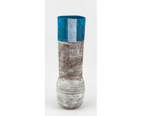 † ROBIN WELCH (1936-2019); a tall oval stoneware vessel with swollen base covered in mottled grey glaze and iron staining wit