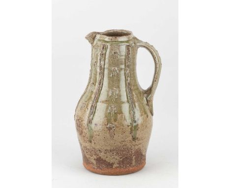 JIM MALONE (born 1946); a stoneware baluster jug covered in green ash glaze over iron slip with incised decoration, impressed