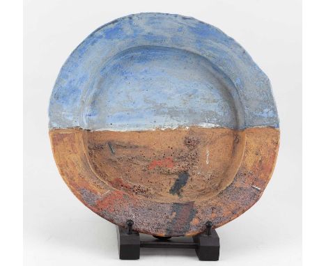 † ROBIN WELCH (1936-2019); a large stoneware landscape platter with partially textured surface, impressed RW mark, pottery st