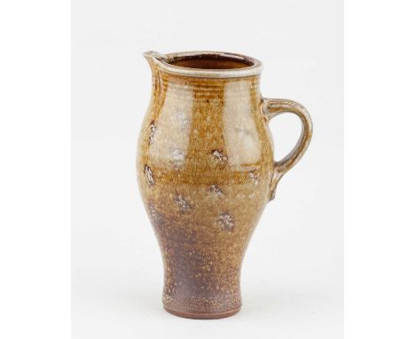 † MICHAEL CASSON (1925-2003); a salt glazed jug partially covered in ash glaze, impressed MC mark, height 23.5cm.Provenance: 