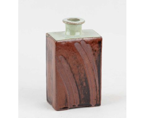 † PHIL ROGERS (1951-2020); a rectangular stoneware bottle covered in tenmoku breaking to kaki glaze with nuka top and finger 