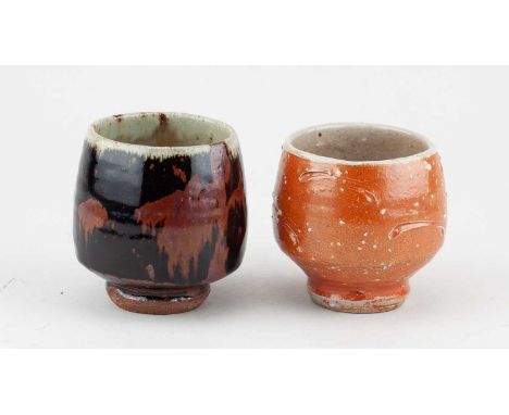 † PHIL ROGERS (1951-2020); a stoneware yunomi covered in tenmoku and kaki glaze with green ash rim, impressed PR mark, height