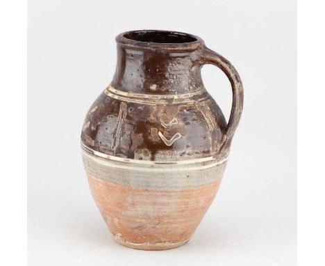 † MICHAEL CARDEW (1901-1983) for Winchcombe Pottery; a slipware baluster jug with yellow slip decoration on chestnut ground, 