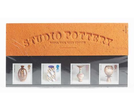 'Studio Pottery', a presentation pack of four stamps designed by Tony Evans featuring works by Bernard Leach, Elizabeth Frits