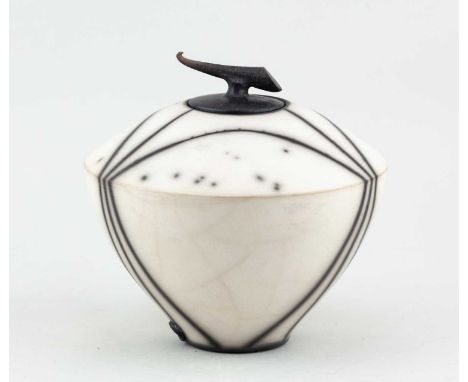 † TIM ANDREWS (born 1960); a raku jar and cover with horn finial, sprigged TA mark dated 2002, height 17cm.   Condition Repor