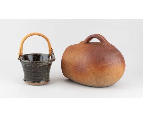 † JOHN LEACH (1939-2021) for Muchelney Pottery; a stoneware basket with cane handle covered in mottled grey and iron glaze, i