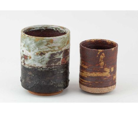 † ROBIN WELCH (1936-2019); a cylindrical stoneware vessel partially covered in bronze glaze with ochre and white top and red 