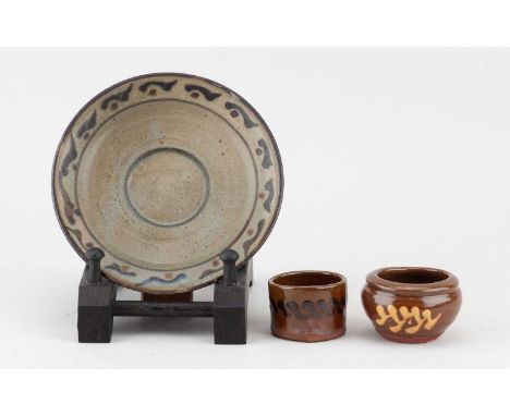 † BERNARD LEACH (1887-1979) for Leach Pottery; a stoneware saucer covered in dark oatmeal glaze with iron decoration, painted