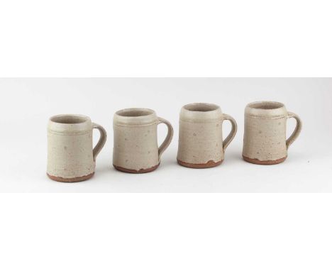 JIM MALONE (born 1946); a quartet of stoneware mugs covered in pale green ash glaze, impressed JM and L (for Lessonhall) mark