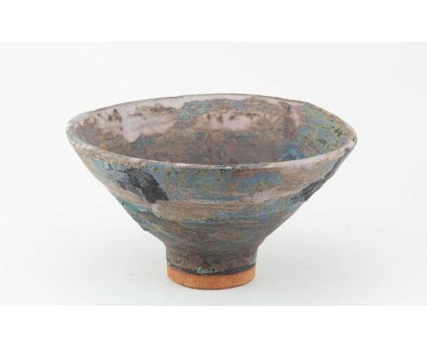 † ROBIN WELCH (1936-2019); a conical stoneware pedestal bowl covered in turquoise, ochre and lilac glaze with black and green