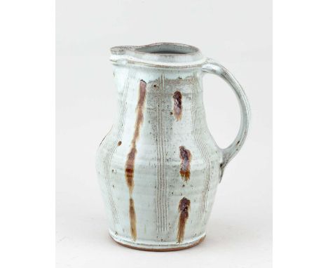 † MIKE DODD (born 1943); a stoneware jug covered in mottled white glaze with iron and combed decoration, impressed MJD mark, 