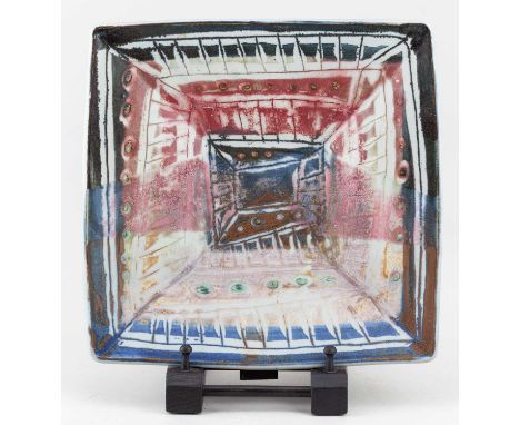 † MARIANNE DE TREY (1913-2016); a large square stoneware dish covered in polychrome glaze, impressed dTe mark, 30.5 x 30cm.Co