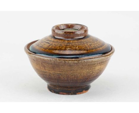 † JIM MALONE (born 1946); a stoneware Korean pot and cover covered in iron glaze with nuka top, impressed JM and A (for Ainst