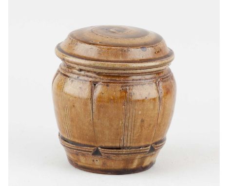 † MIKE DODD (born 1943); a stoneware caddy covered in granite and iron glaze, impressed MJD mark, height 13.5cm.Condition Rep