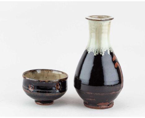 † JIM MALONE (born 1946); a stoneware Korean bottle covered in tenmoku breaking to kaki glaze with nuka top and wax resist de