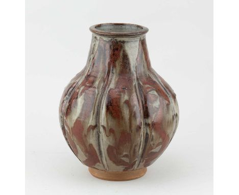 † HONORAH MAIDA FRENCH; a lobed stoneware vase covered in grey glaze with kaki decoration, incised HF mark, height 24cm.  Mis