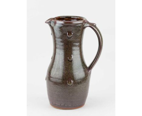 † RAY FINCH (1914-2012) for Winchcombe Pottery; a tall stoneware jug covered in iron rich and tea dust glaze with impressed d