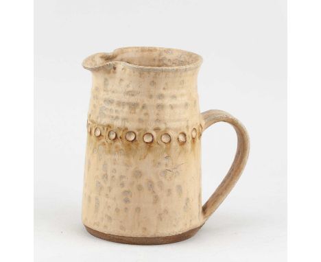 † BERESFORD PEALING (born 1932); a stoneware jug covered in yellow glaze with impressed decoration, impressed BP mark, height