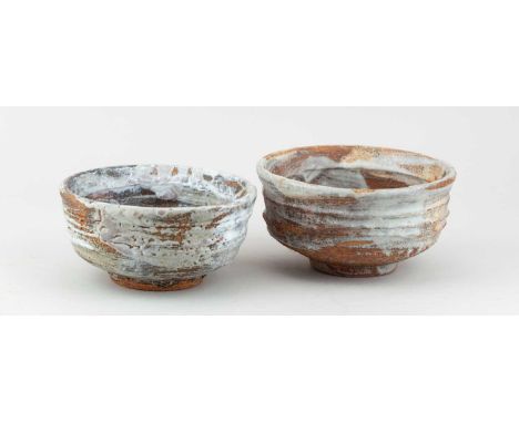 † ROBIN WELCH (1936-2019); a footed stoneware bowl with ribbed surface partially covered in pale grey glaze, diameter 16cm, a