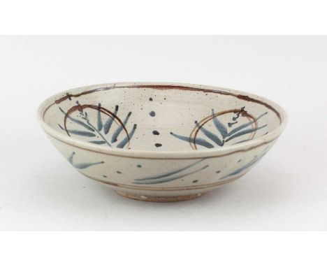 † URSULA MOMMENS (1908-2010); a stoneware bowl covered in pale grey glaze with iron and cobalt decoration, impressed UD mark,