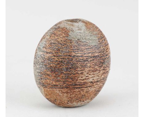 † ALAN WALLWORK (1931-2019); a stoneware pebble form partially covered in grey/green glaze with iron staining, incised AW mar