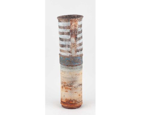 † ROBIN WELCH (1936-2019); a tall cylindrical stoneware vessel with bands of sandy yellow, grey and mottled blue glaze with i