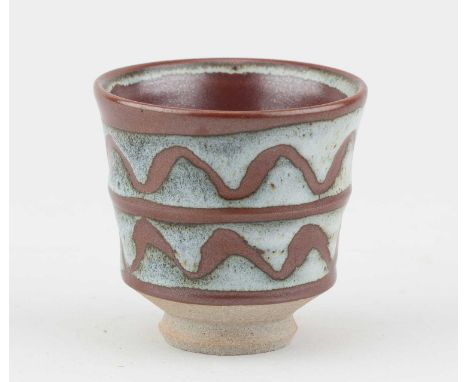 † JOHN LEACH (1939-2021) for Muchelney Pottery; a stoneware yunomi covered in kaki and dolomite glaze, impressed JHL mark, he