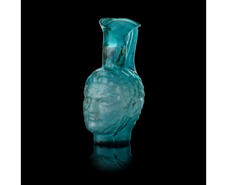 ROMAN STYLE PORTRAIT GLASS VESSEL AFTER THE ANTIQUE mould-blown in translucent light blue colour with silver iridescence, wit