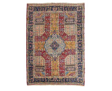 KIRMAN CARPET CENTRAL PERSIA, MID/LATE 20TH CENTURY of Garden design, the compartmentalised field with cream and indigo medal