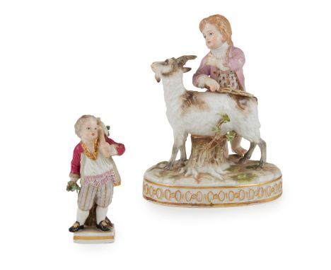 TWO MEISSEN PORCELAIN FIGURES SECOND HALF 19TH CENTURY comprising a figure of a boy wearing a pink coat, standing beside a go