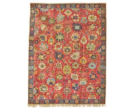 TETEX CARPET GERMANY, EARLY/MID 20TH CENTURY the red field with allover palmette and vine pattern, within indigo border(395cm