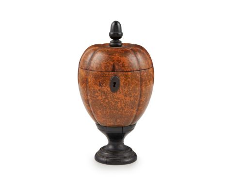 GEORGE III STAINED FRUITWOOD MELON-FORM TEA CADDY LATE 18TH CENTURY with an ebonised acorn finial and turned foot, opening to
