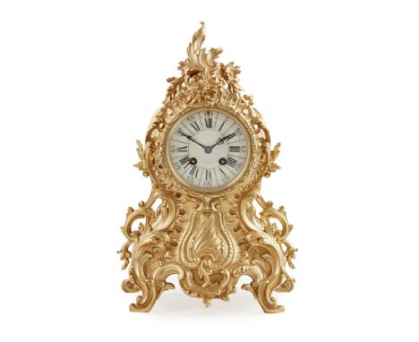 FRENCH ROCOCO REVIVAL GILT METAL MANTEL CLOCK LATE 19TH CENTURY the cream enamel dial with Roman numbers and twin winding hol