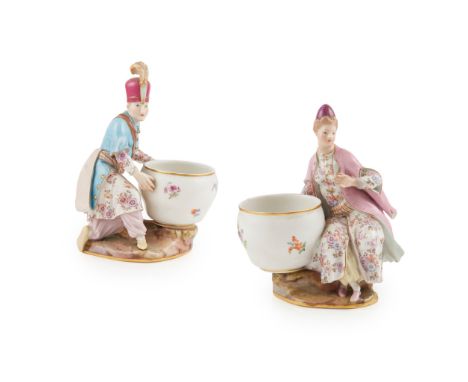 PAIR OF MEISSEN FIGURAL SALTS LATE 19TH CENTURY the figures in Ottoman dress, the gentleman wearing a plumed red hat, the lad