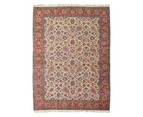 TABRIZ CARPET NORTHWEST PERSIA, MID 20TH CENTURY the ivory field with allover palmette pattern, within red border(361cm x 270