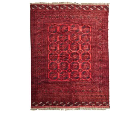 ERSARI CARPET TURKMENISTAN, EARLY/MID 20TH CENTURY the red field with four columns of six guls, within multiple borders(414cm