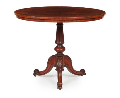 Y REGENCY ROSEWOOD OCCASIONAL TABLE, IN THE MANNER OF GILLOWS EARLY 19TH CENTURY the oval top on a fluted column and acanthus