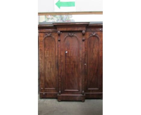 A Victorian mahogany 3 door combination wardrobe with 3 drawers in centre section. The wardrobe is 88" tall. The are no split