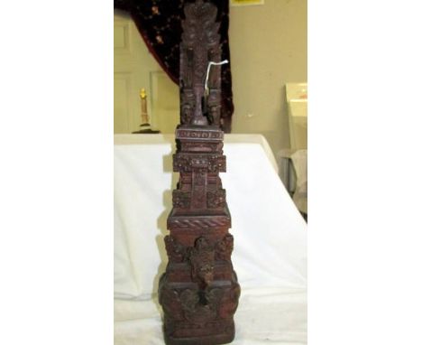 An intricately carved teak hardwood, probably Balinese, Hindu temple gate column carving. Features include bird-god Garuda, o