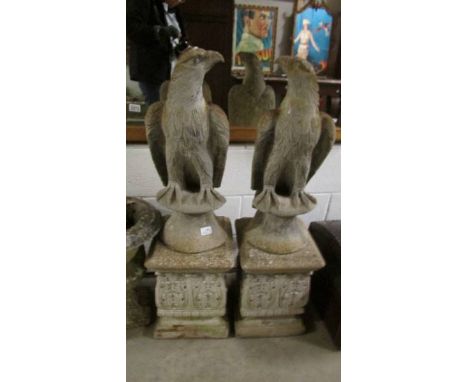 A pair of eagle garden statues. ****Condition report**** Eagle height 62.5cm.
Pillar height 43cm.
Total height 105.5cm.
Both 