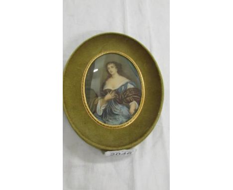 A velvet framed oval portrait of a lady signed Hirnio, glass a/f.