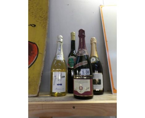 A bottle of Welsh cream liqueur and 3 bottles of champagne/sparkling wine.