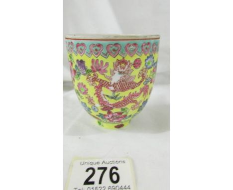 A Chinese eggshell porcelain yellow ground famille rose bowl (wine cup?), Tongzhi 6 character reign mark in red, probably of 