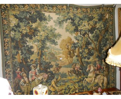 A large vintage handmade 20th century wall hanging tapestry. It is of a French hunting scene with wild boar, dogs and a Frenc