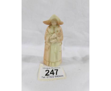 An early Royal Worcester candle snuffer in the form of a nun. ****Condition report**** In good condition with no damage but h